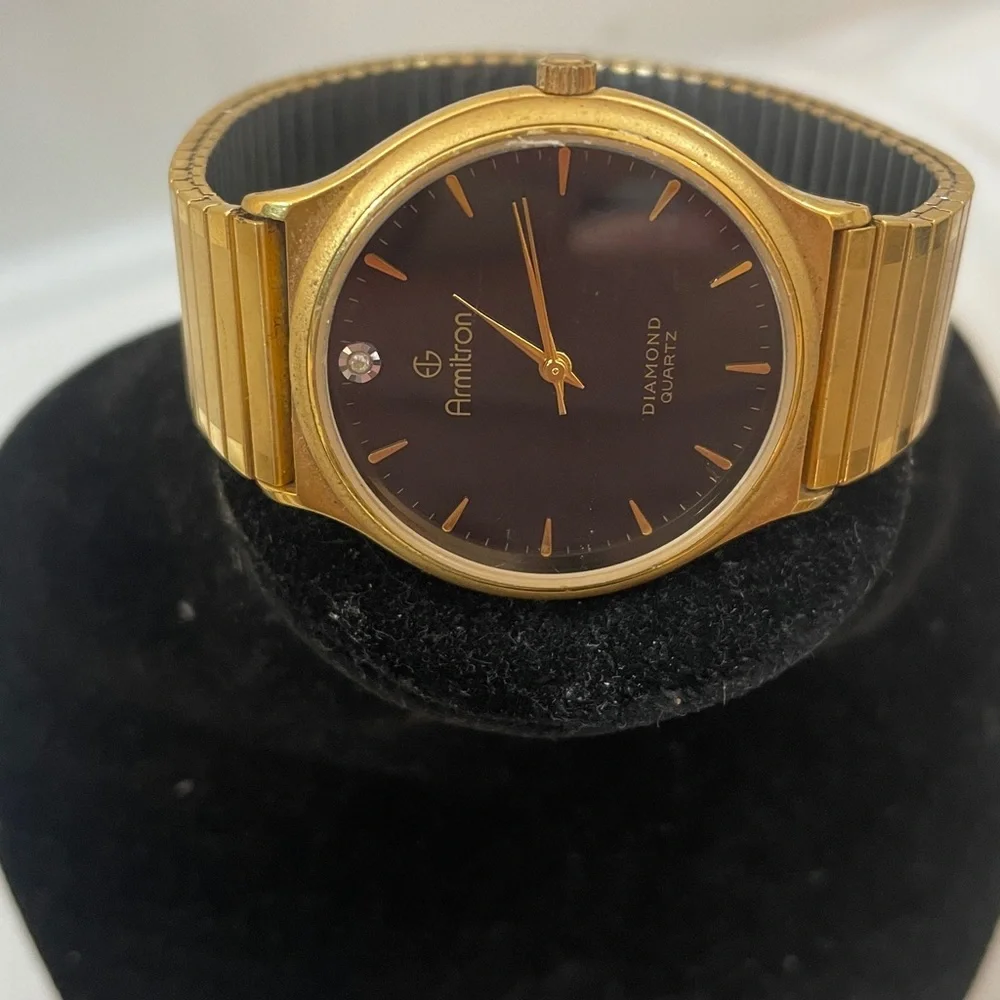 Armitron Gold Tone Watch w/ Black Dial and Single Diamond Accent needs battery
